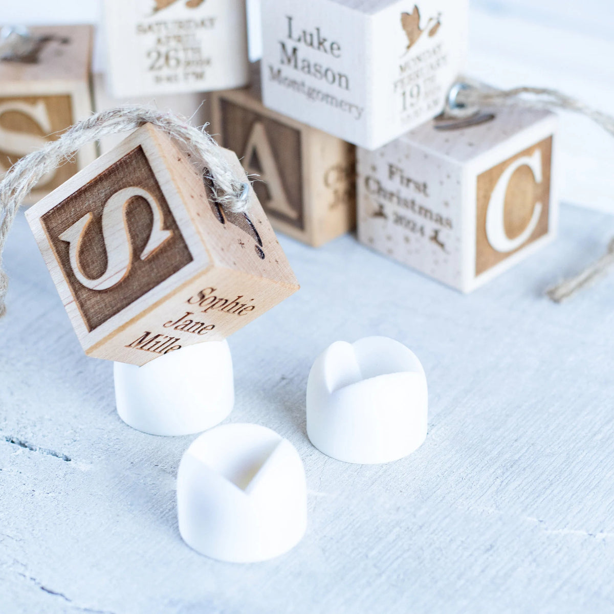  Wooden baby name block with welcomed by family names engraved. Comes with a mount